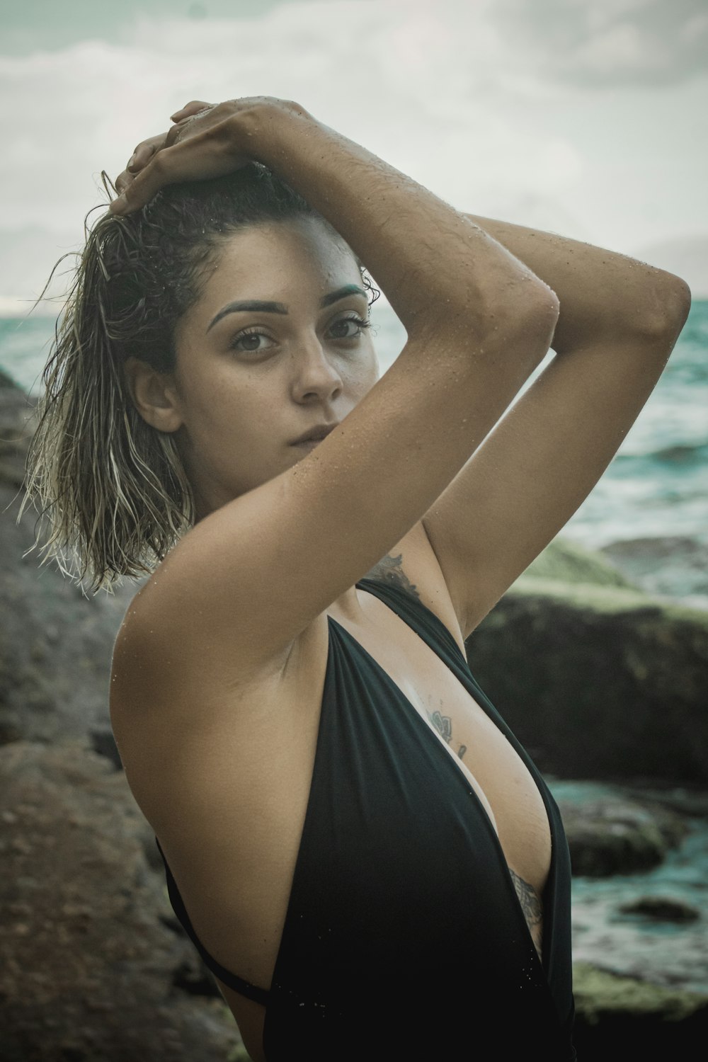 woman in black and white stripe bikini top