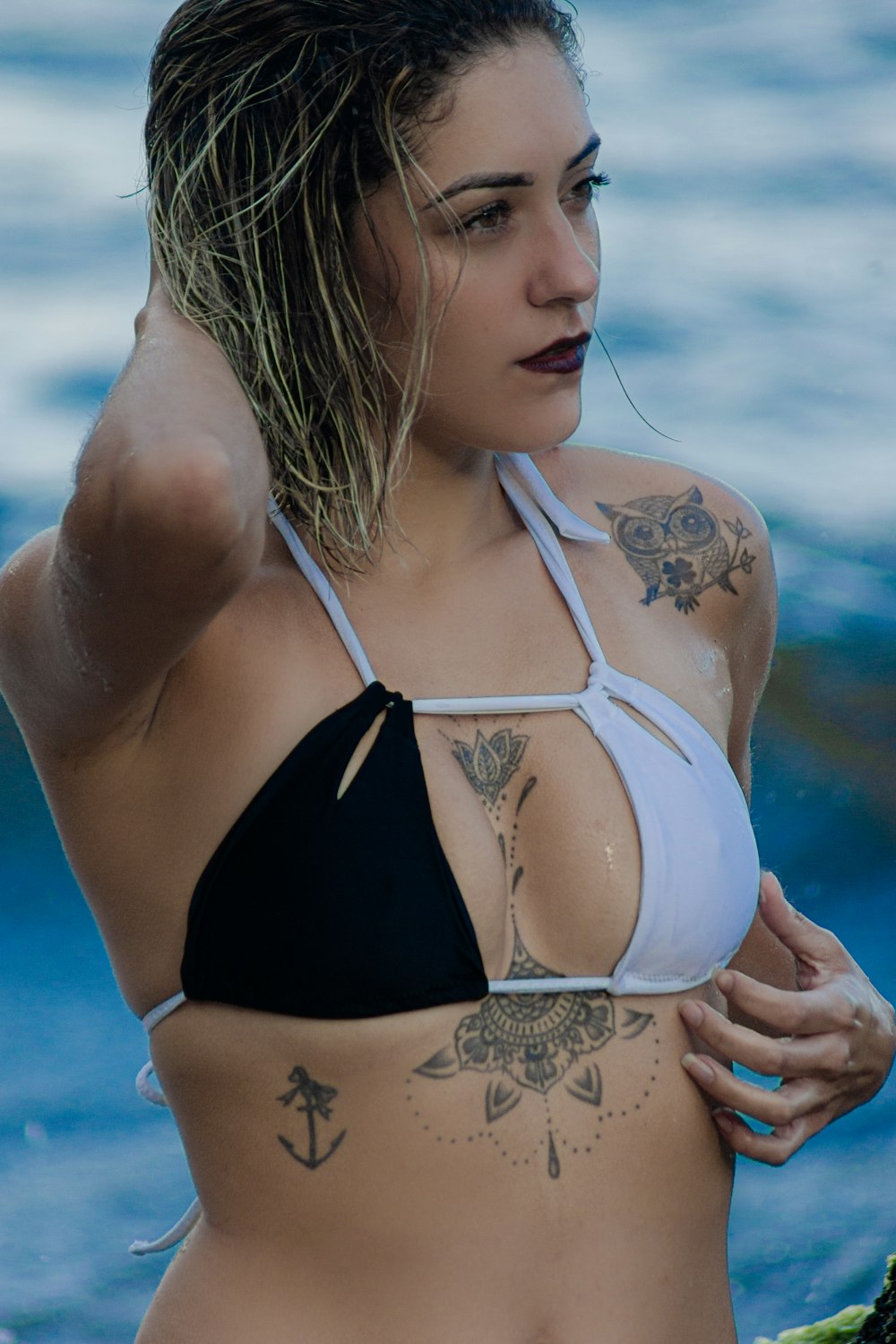 woman in black and white polka dot bikini top