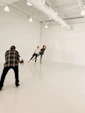 A bright, airy photography studio with large windows and a luxurious jet set location.