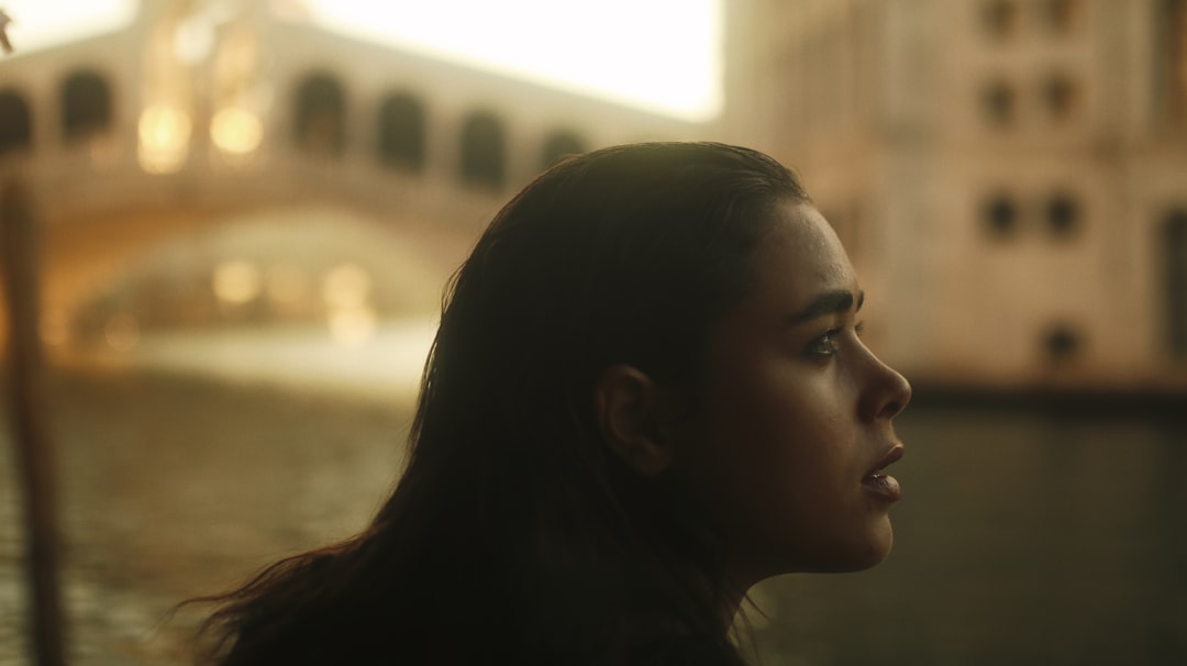 woman looking at the window during daytime