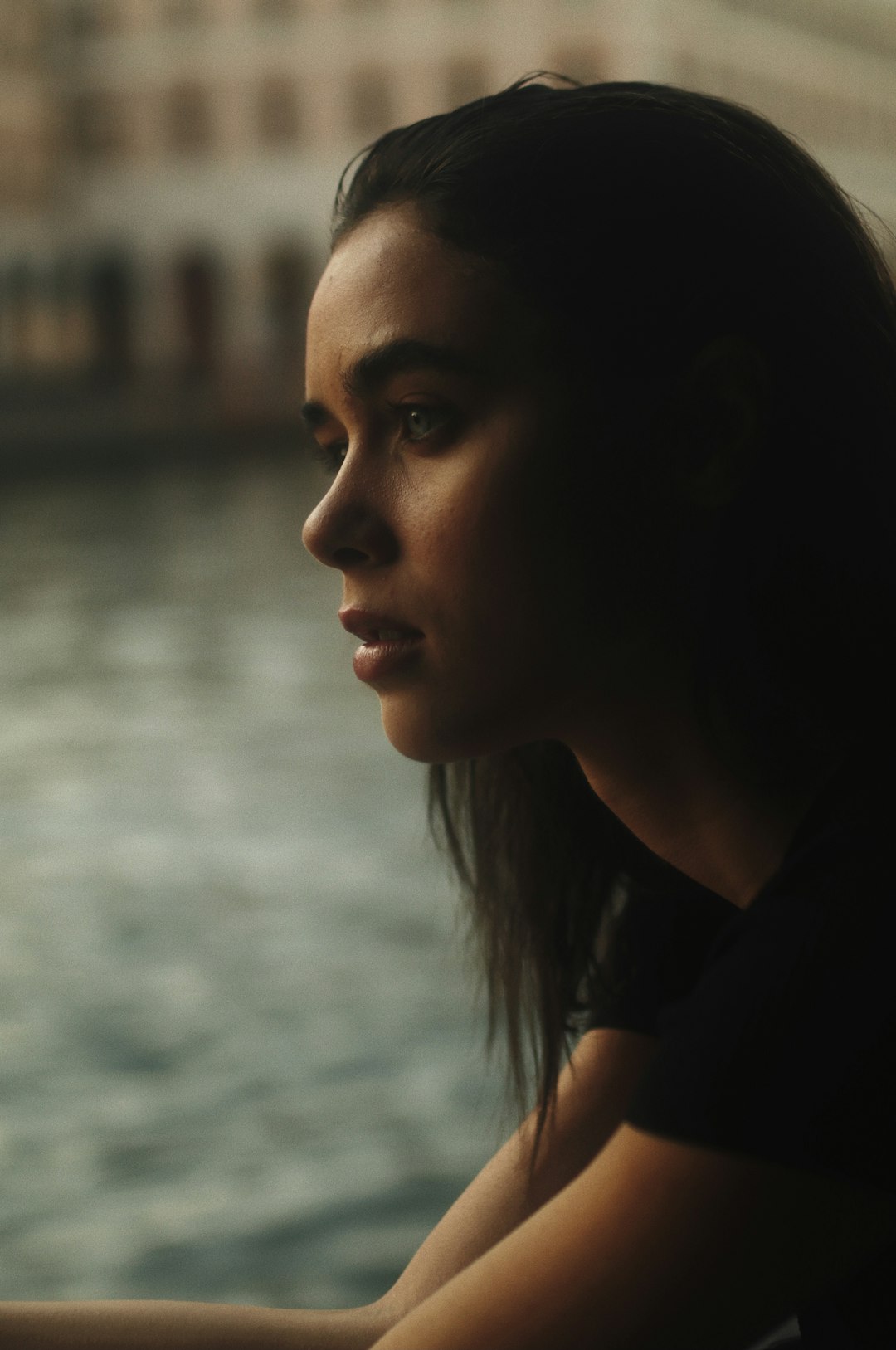 woman in black shirt looking to the right