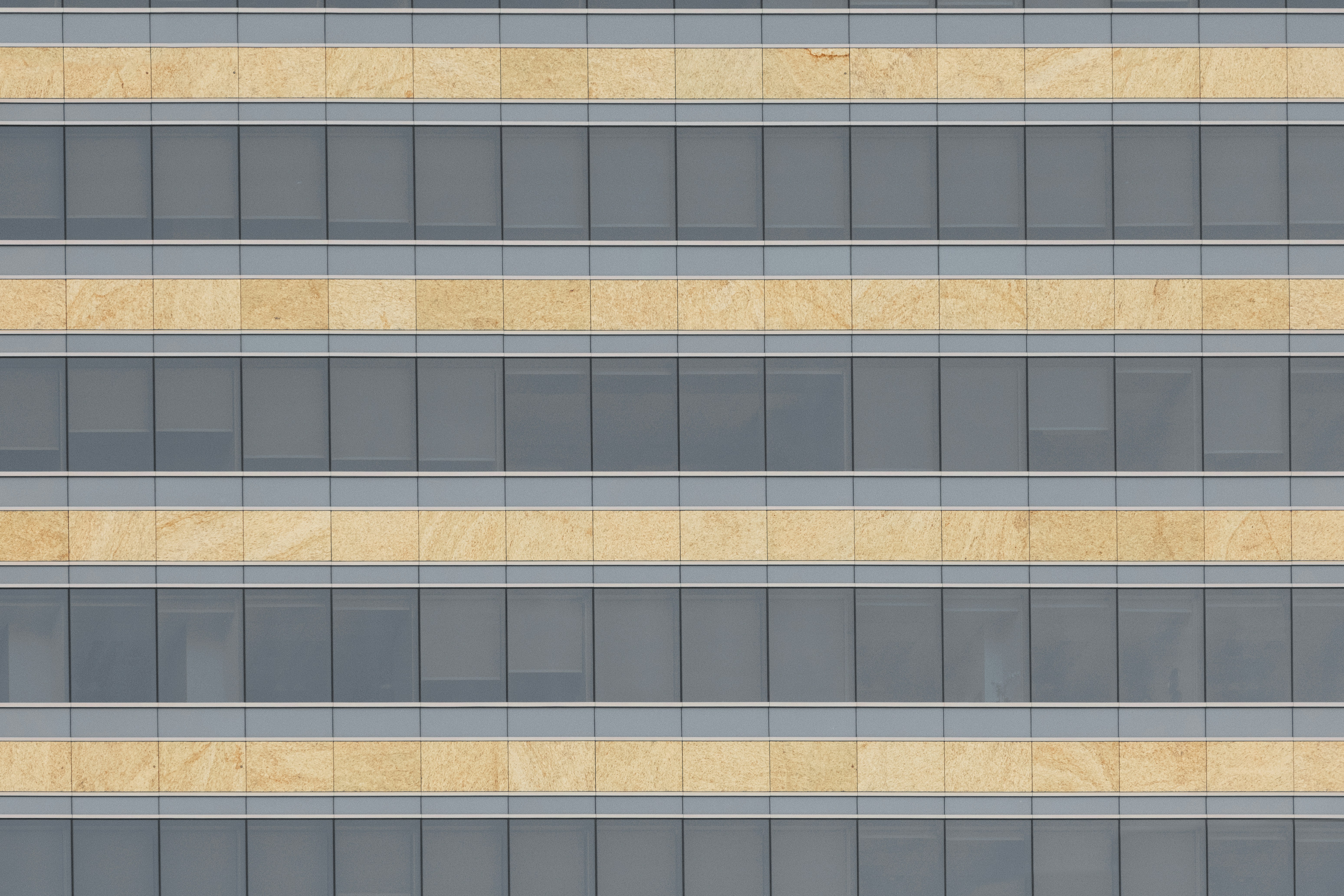 Tower building with grey and yellow windows