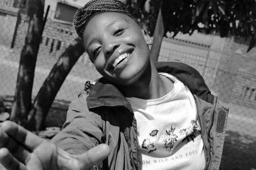 A friendly young person reaching out to connect.