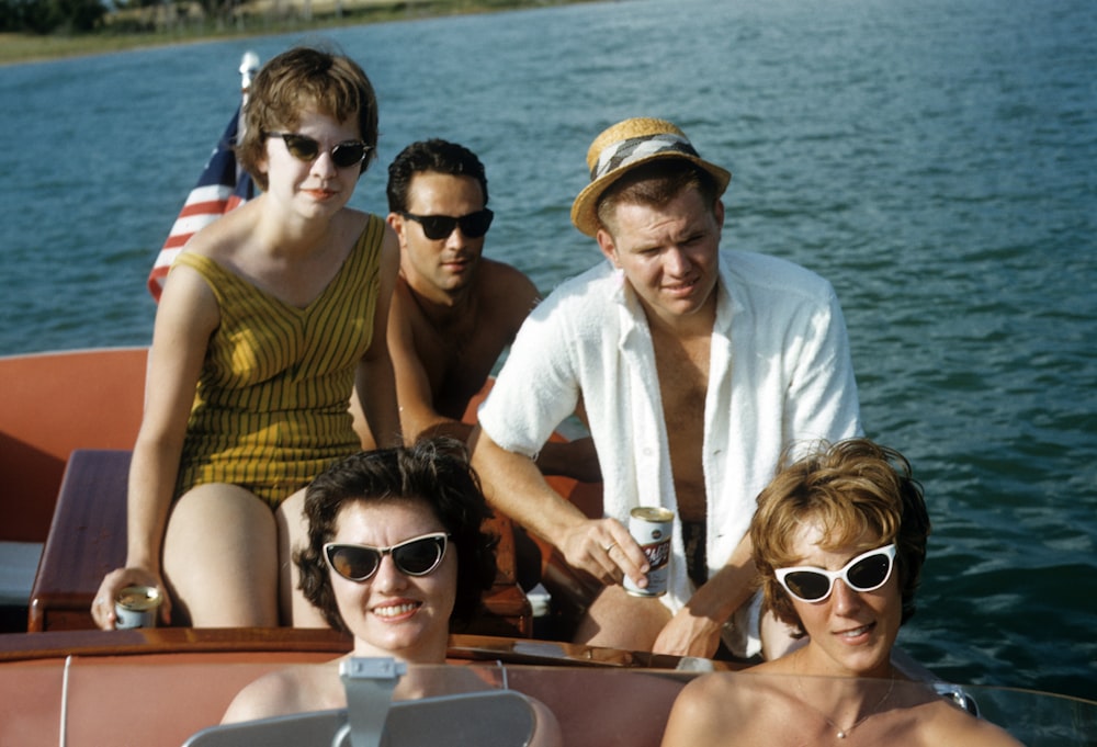 man in white polo shirt wearing black sunglasses