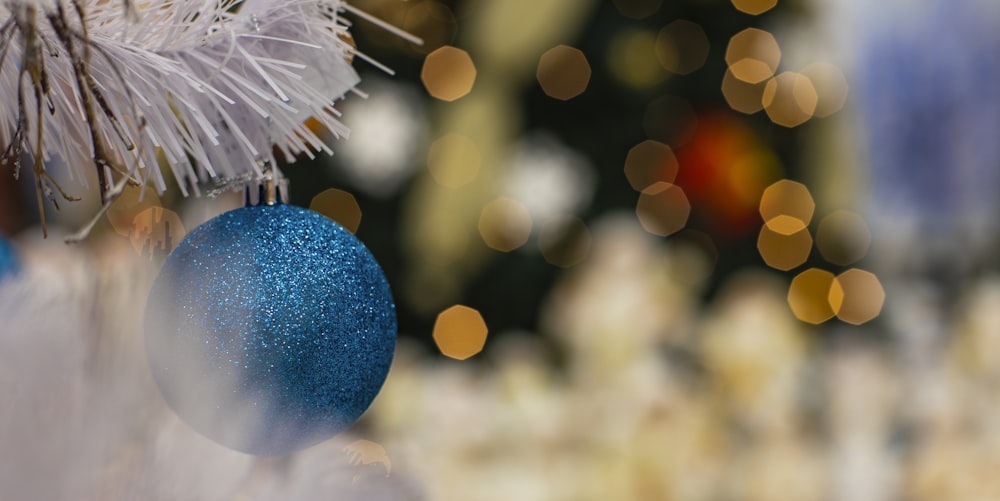 blue and white ball with bokeh lights