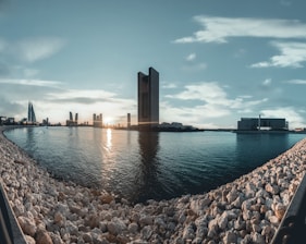 A panoramic view of Dubai’s skyline at sunset highlighting luxury waterfront properties.