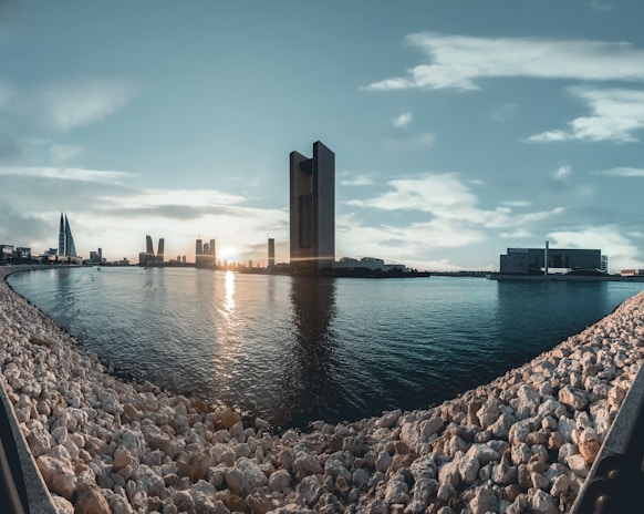 A panoramic view of Dubai’s skyline at sunset highlighting luxury waterfront properties.