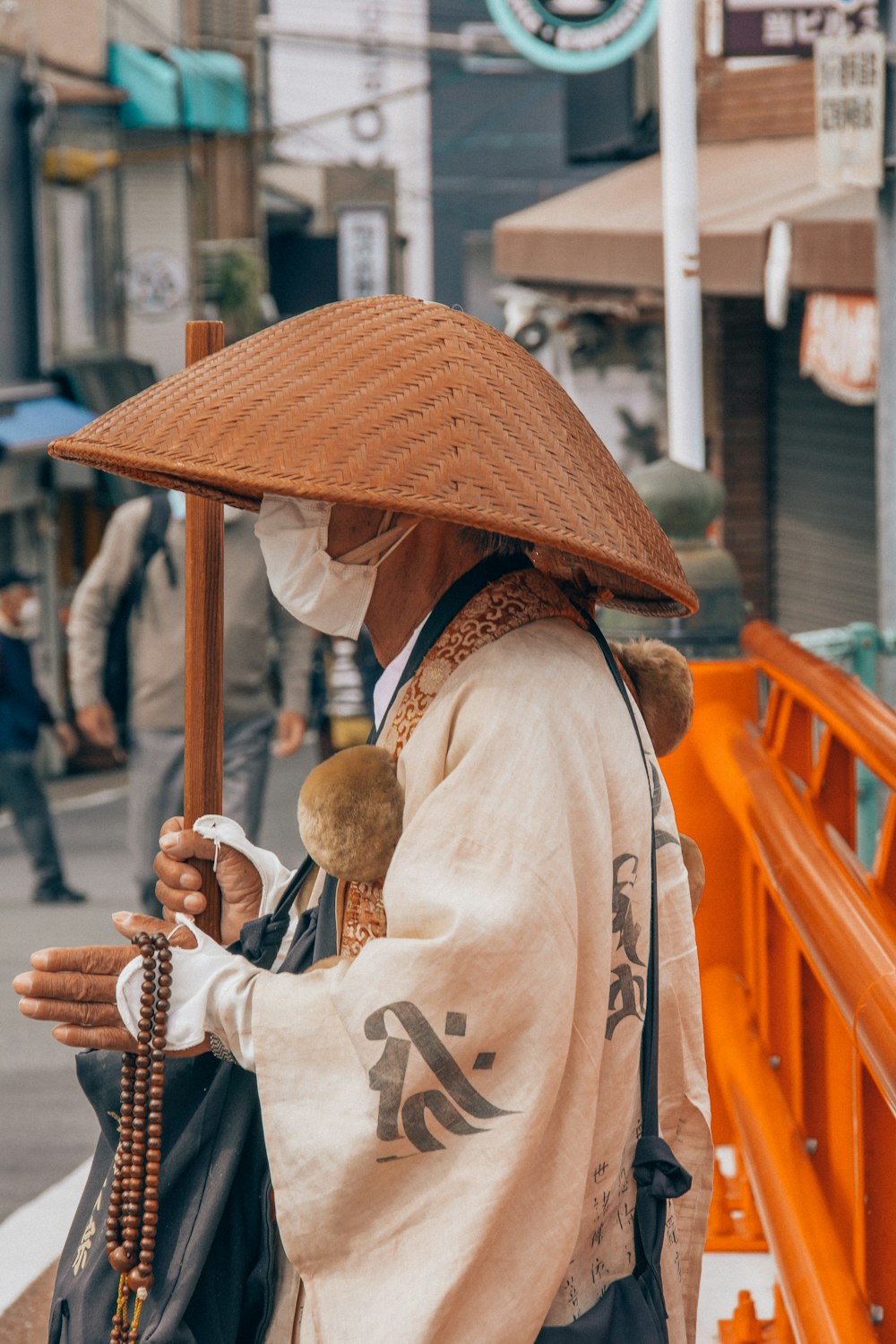 woman in brown sun hat and white long sleeve shirt