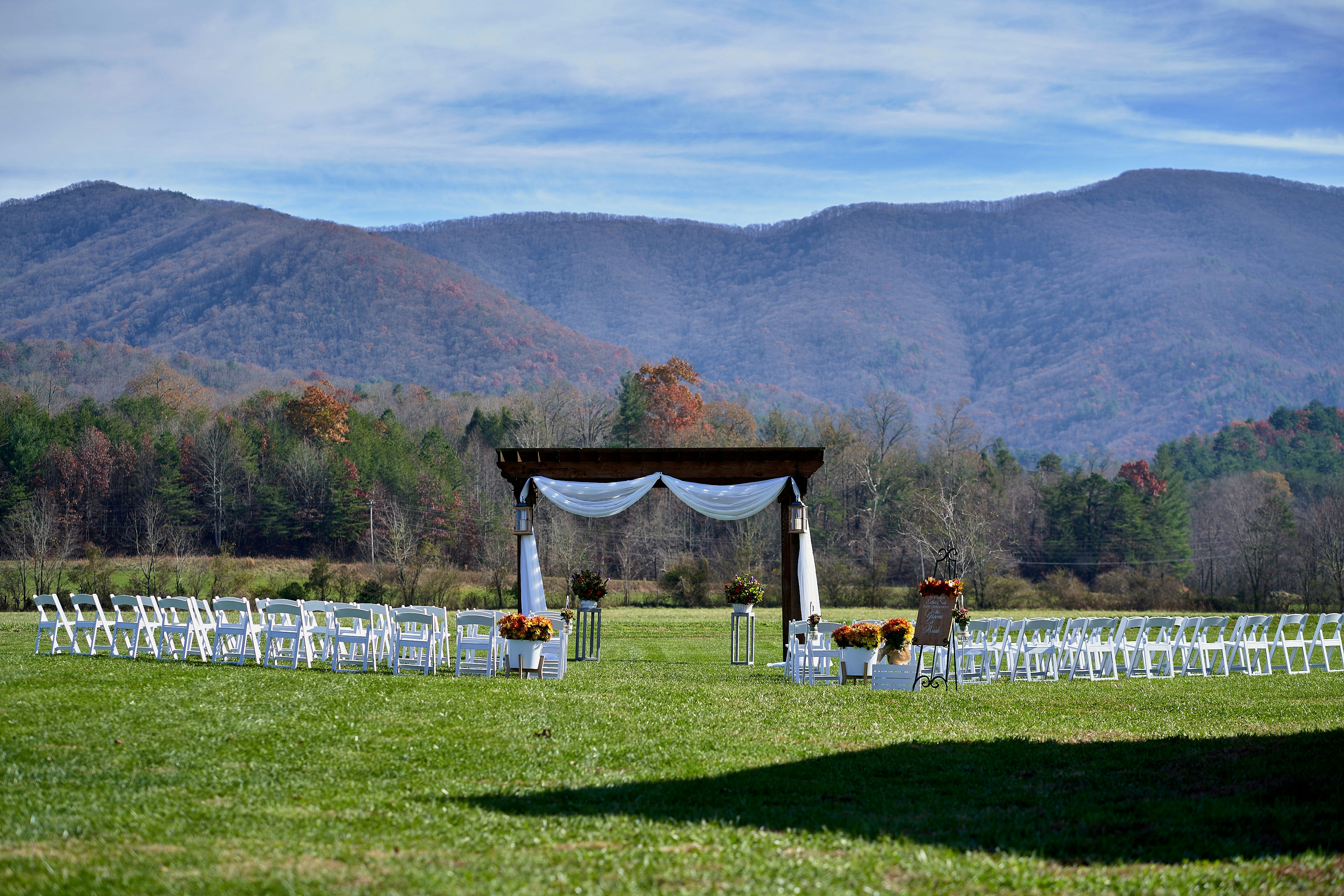 wedding ceremony decor at the barn at young harris in young harris georgia.