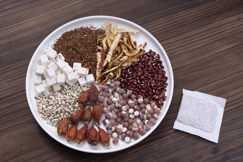 brown and white beans on white ceramic bowl