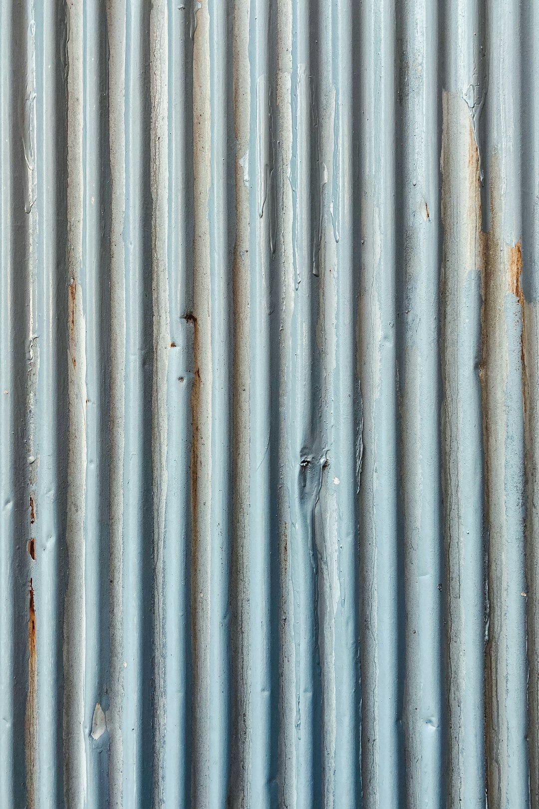 white metal fence with hole