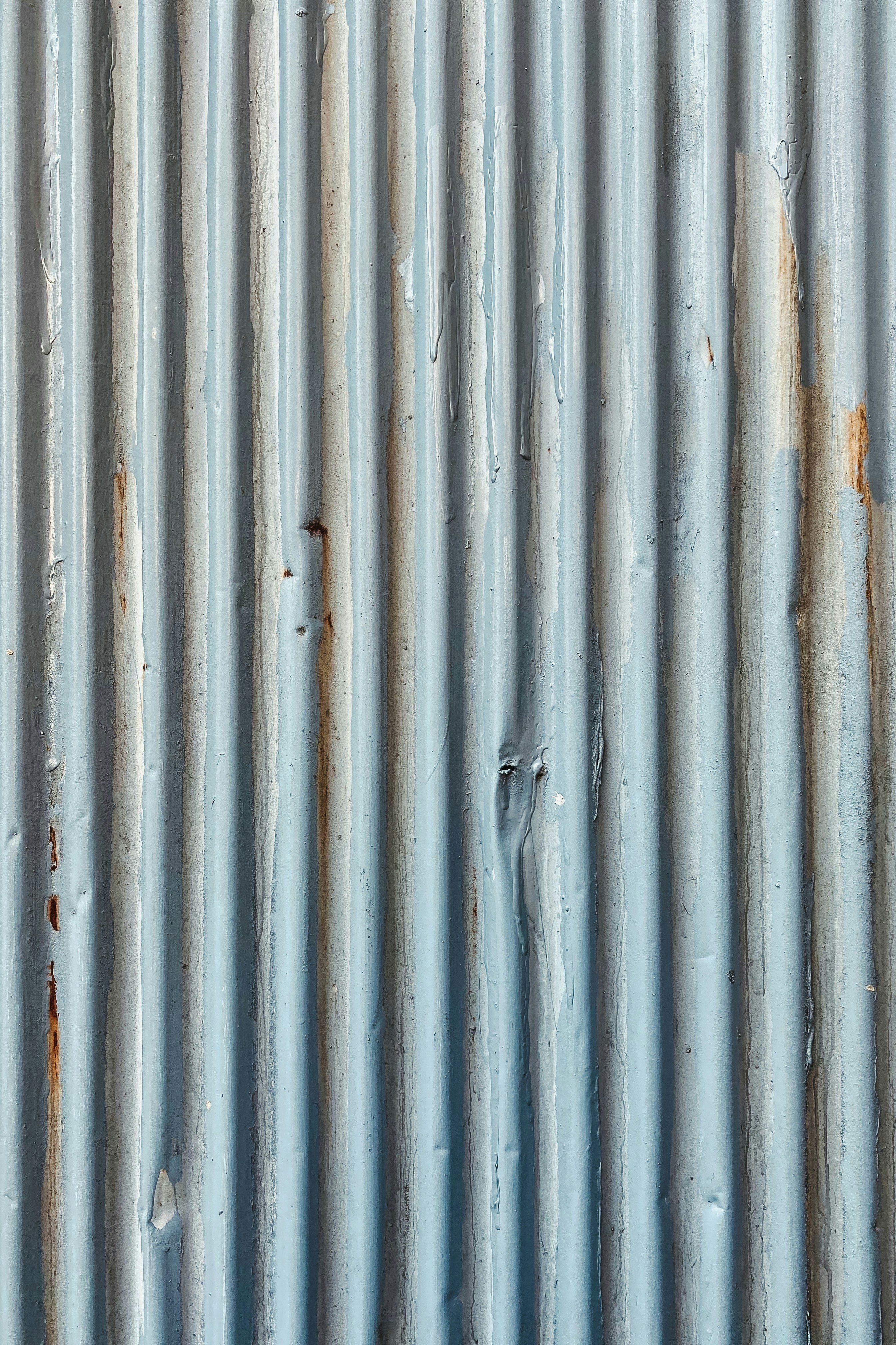 white metal fence with hole