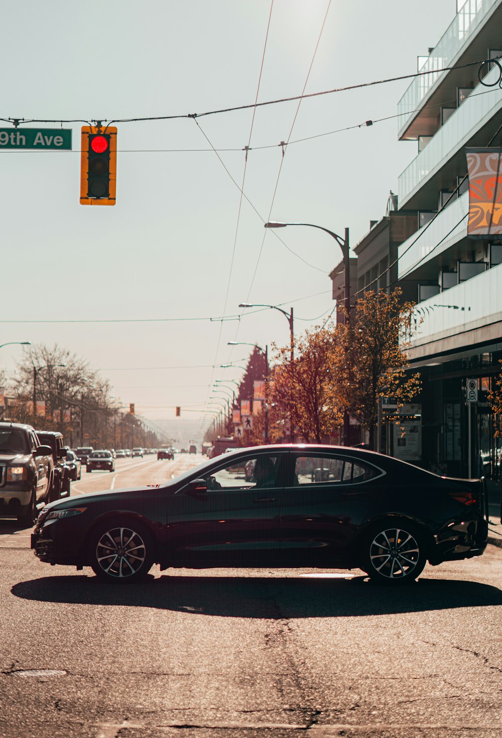 black sedan on road during daytime