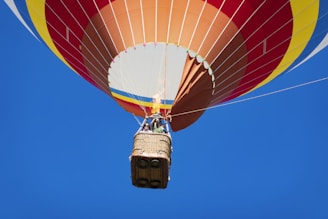 A colorful hot air balloon simulator with guests enjoying the ride.