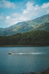 white and red boat on water during daytime