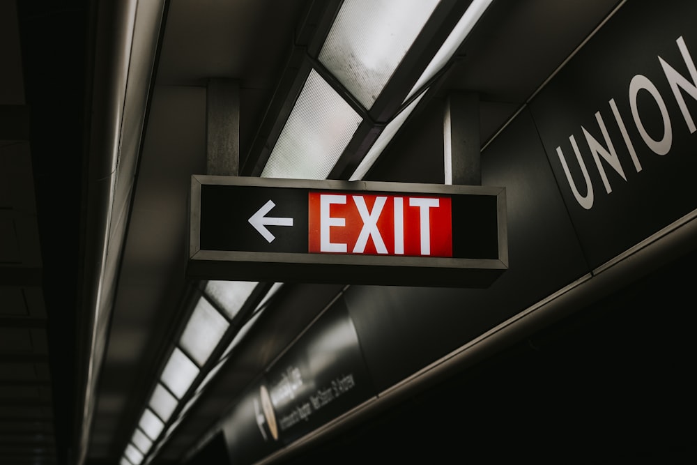 black and white exit sign