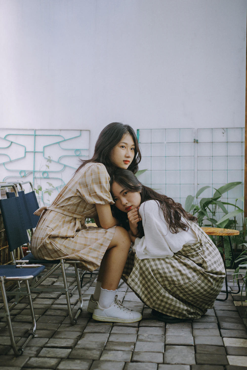 Two friends sitting close together in a supportive conversation