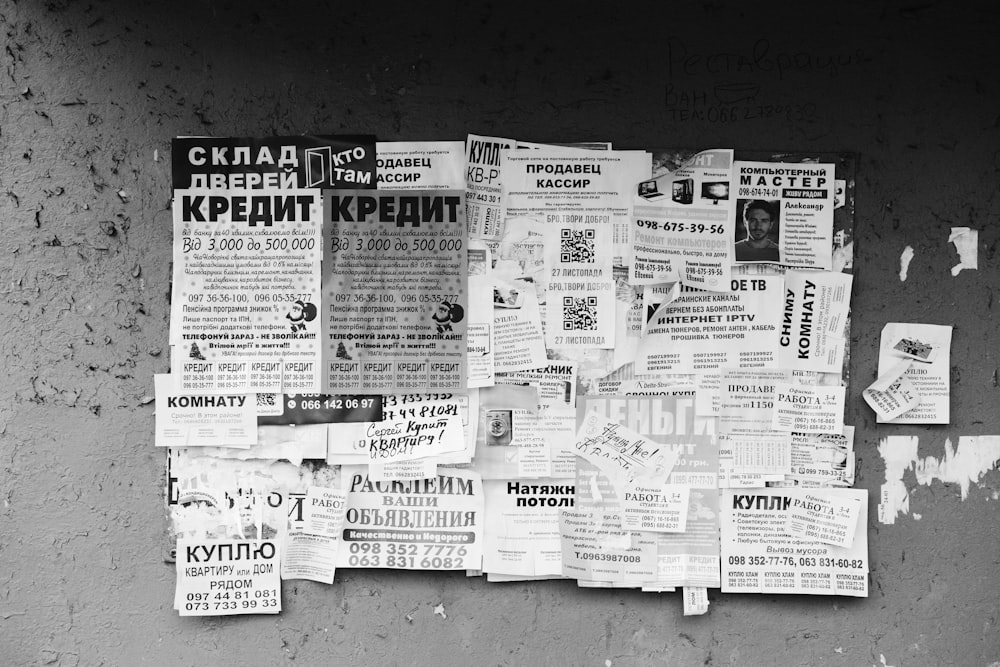 grayscale photo of newspaper on black surface