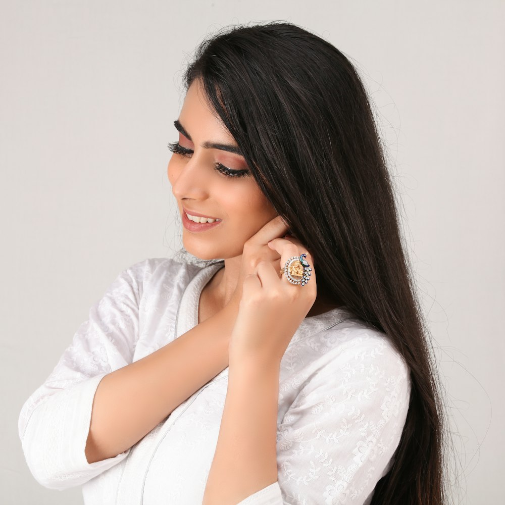 woman in white long sleeve shirt