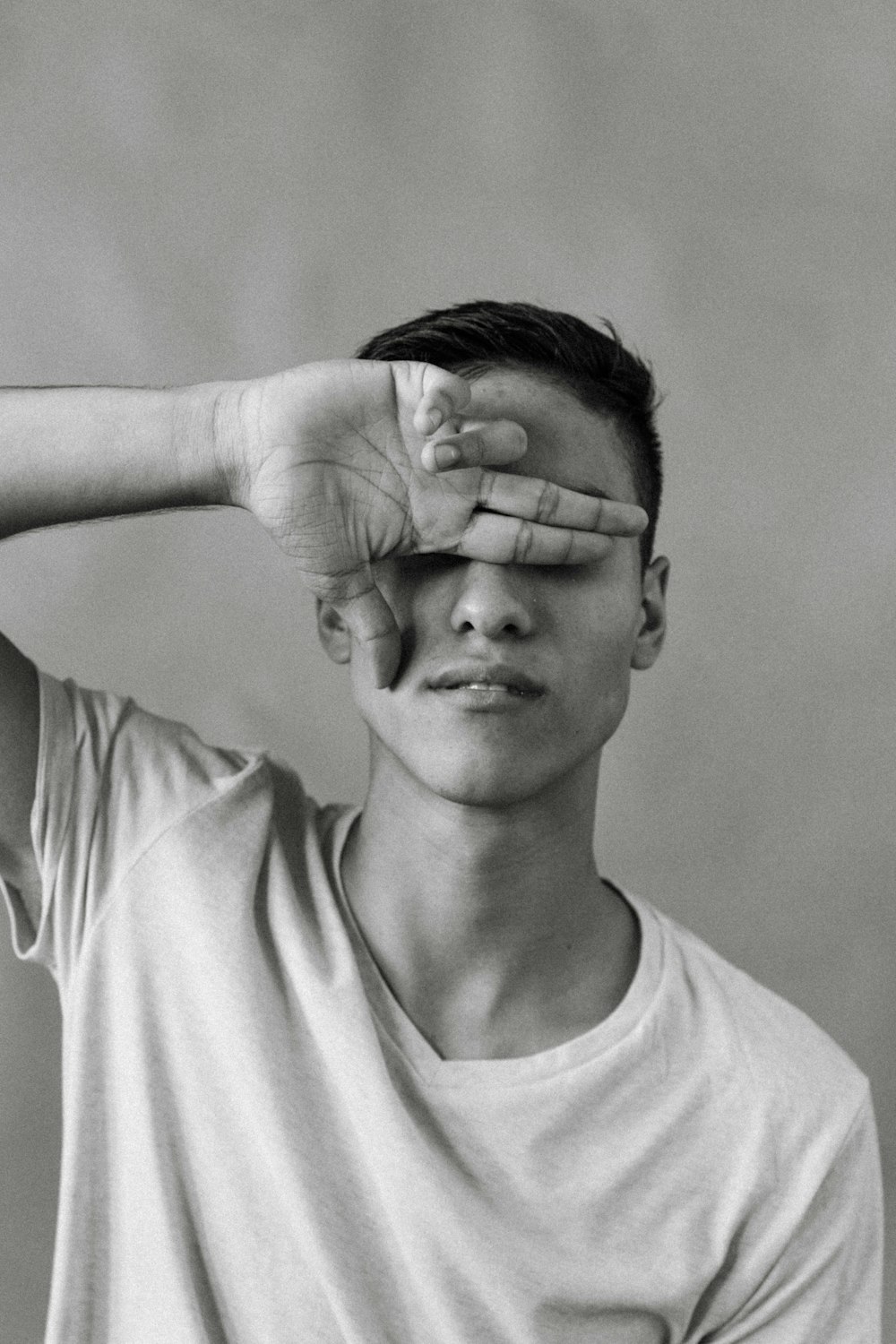 grayscale photo of man in crew neck t-shirt