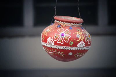 Decorated wedding pots with intricate traditional patterns and vibrant floral accents.