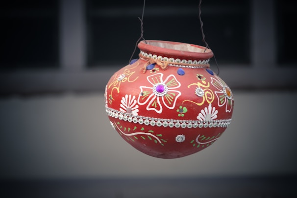 Close-up of a beautifully decorated ceremonial pot used in the rituals at Ayodhya’s tirth places.