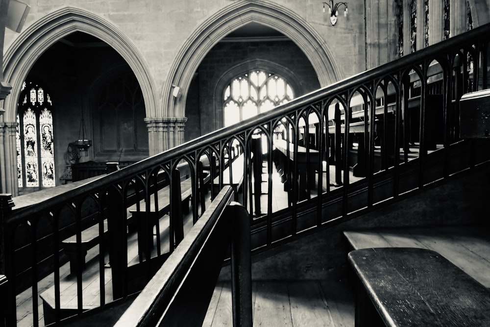 black metal railings on gray concrete staircase