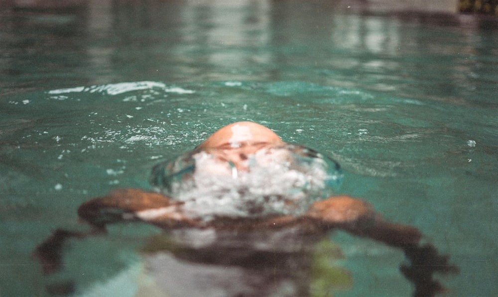 person swimming in the water