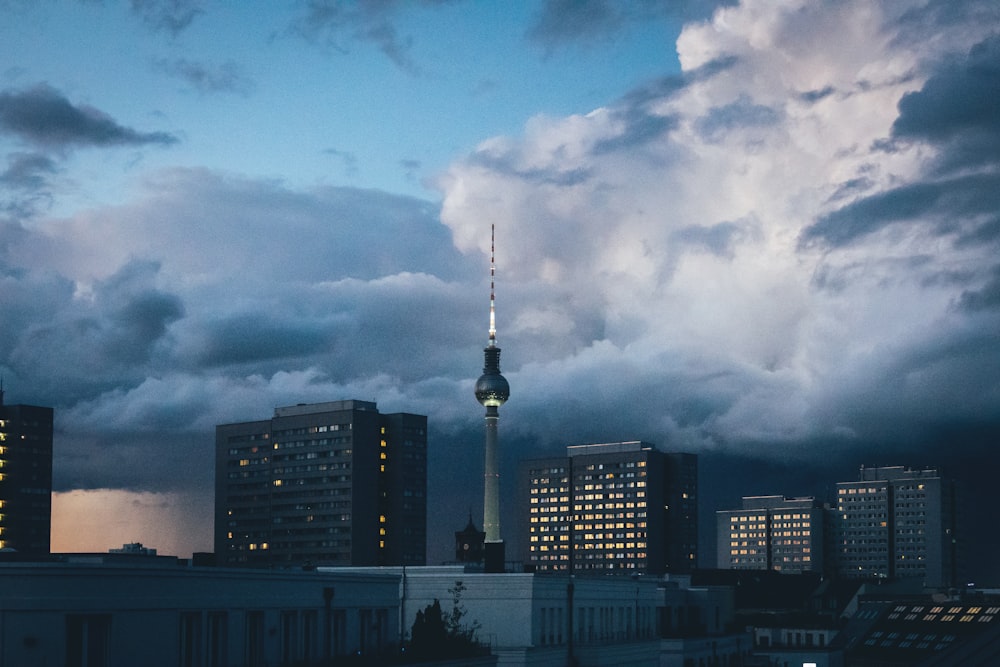 high rise buildings under white clouds during daytime