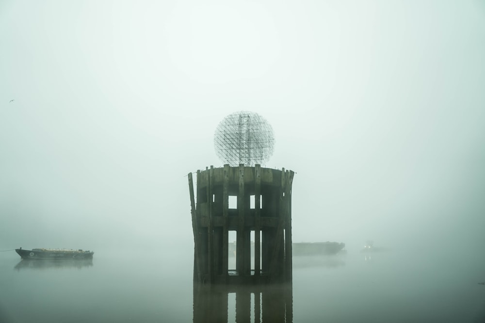 gray concrete building on body of water