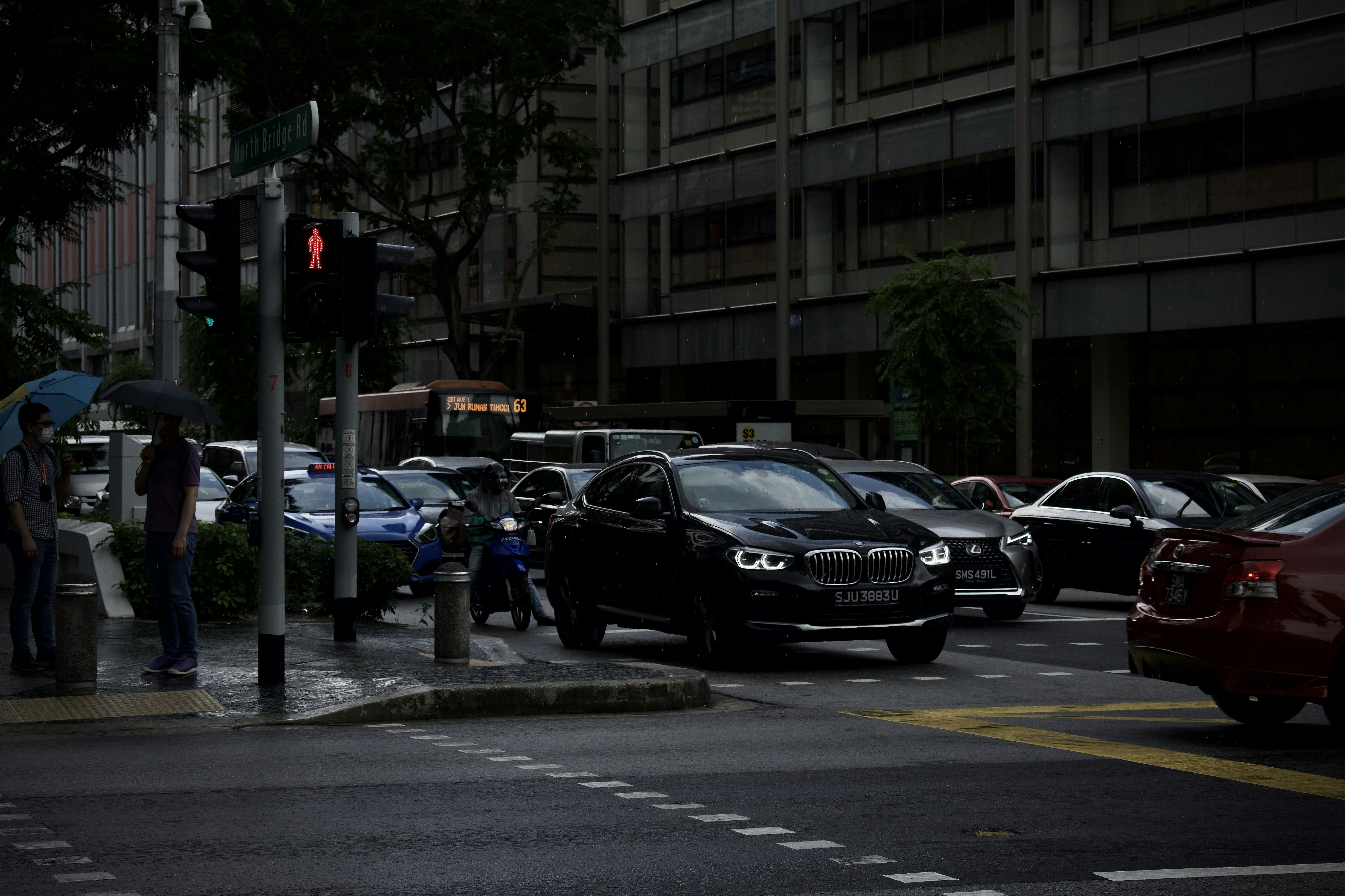 black sedan on road during daytime