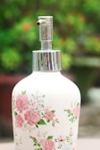 A trendy, colorful soap dispenser displayed in a bathroom.