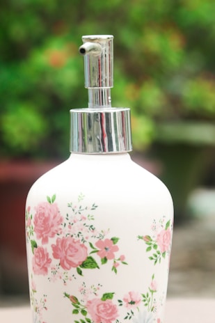 Small thrifted vases repurposed as elegant soap dispensers.