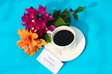 A handwritten note with loving words beside a cup of coffee on a wooden table.