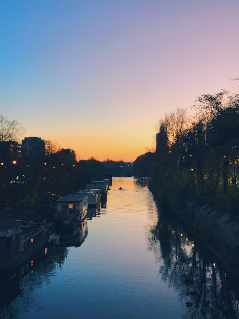 boat on river during sunset