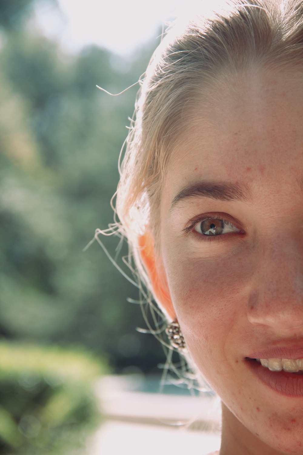 woman with white flower on her ear