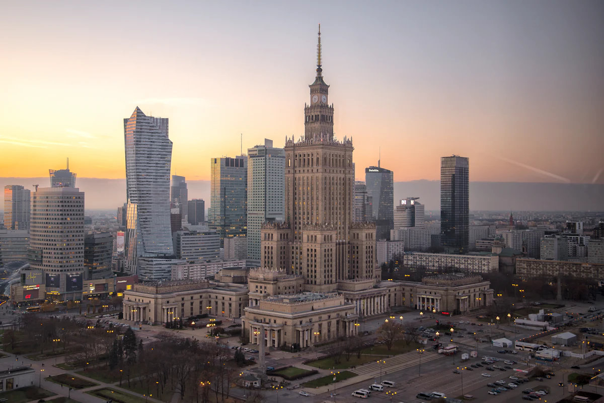 The Warsaw skyline at dusk, with the Palace of Culture and Science among the towers