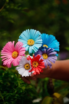 A hand bouquet made of colorful flowers.