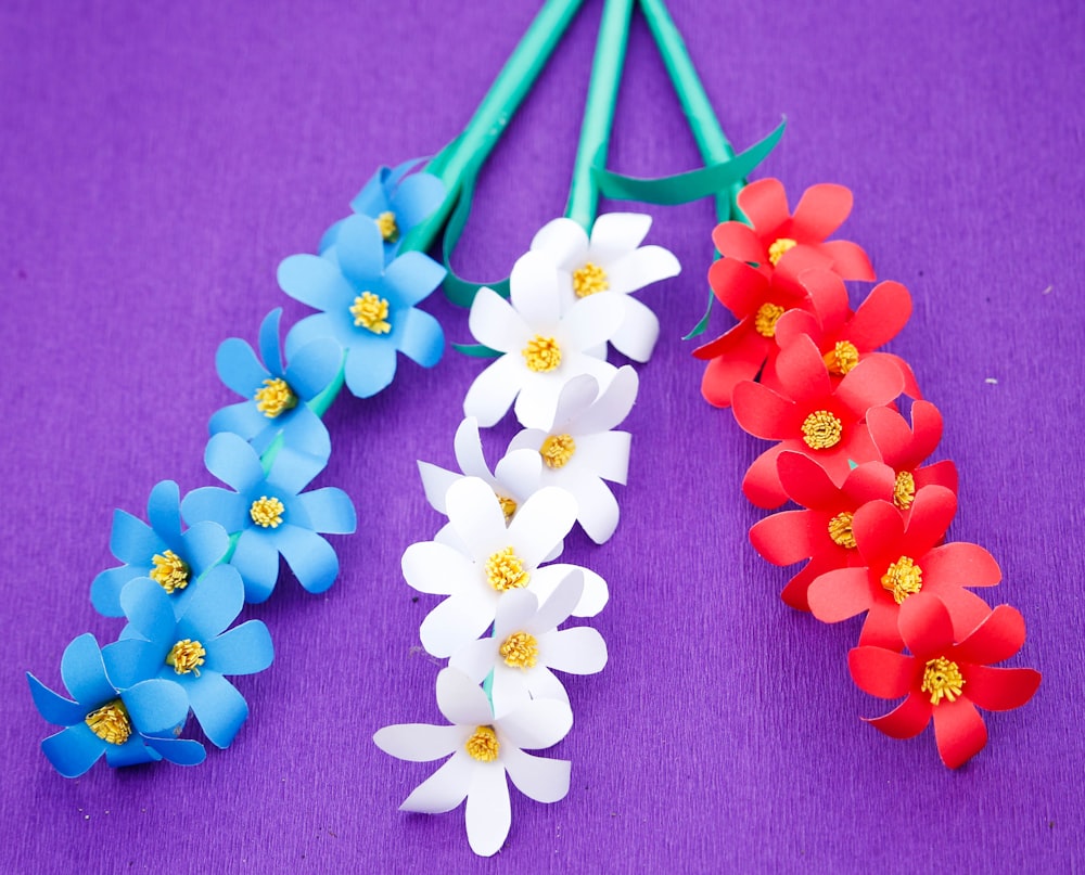 white red and blue flowers on gray textile