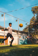 man in gray shirt playing basketball during daytime