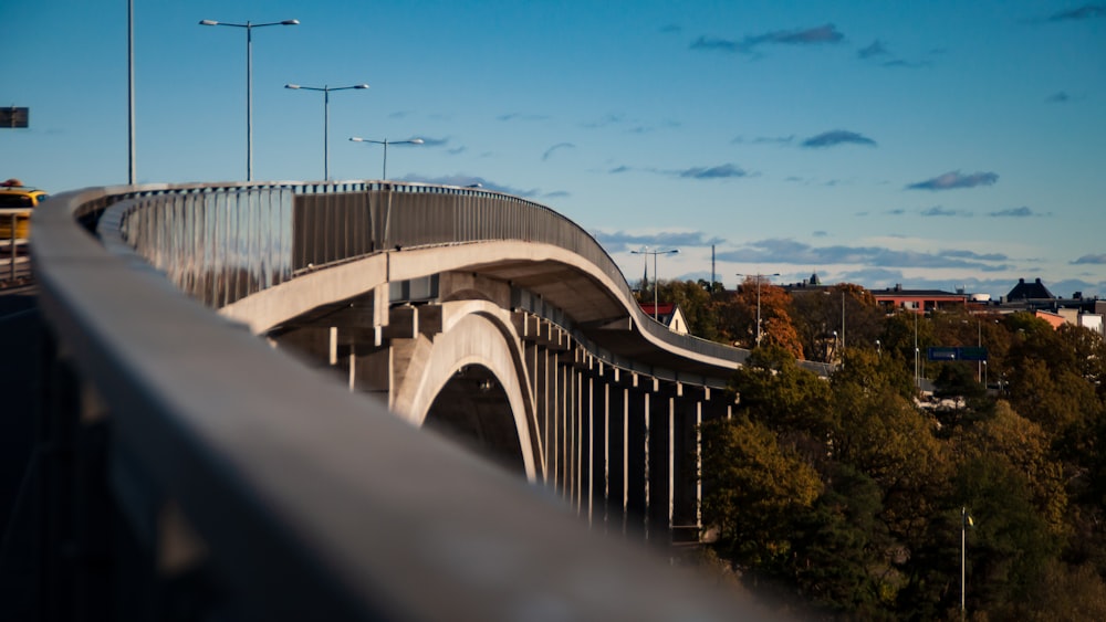 white concrete bridge under blue sky during daytime