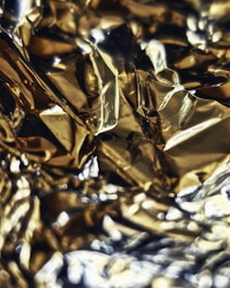 Close-up of shiny foil stamping on a luxury product packaging.