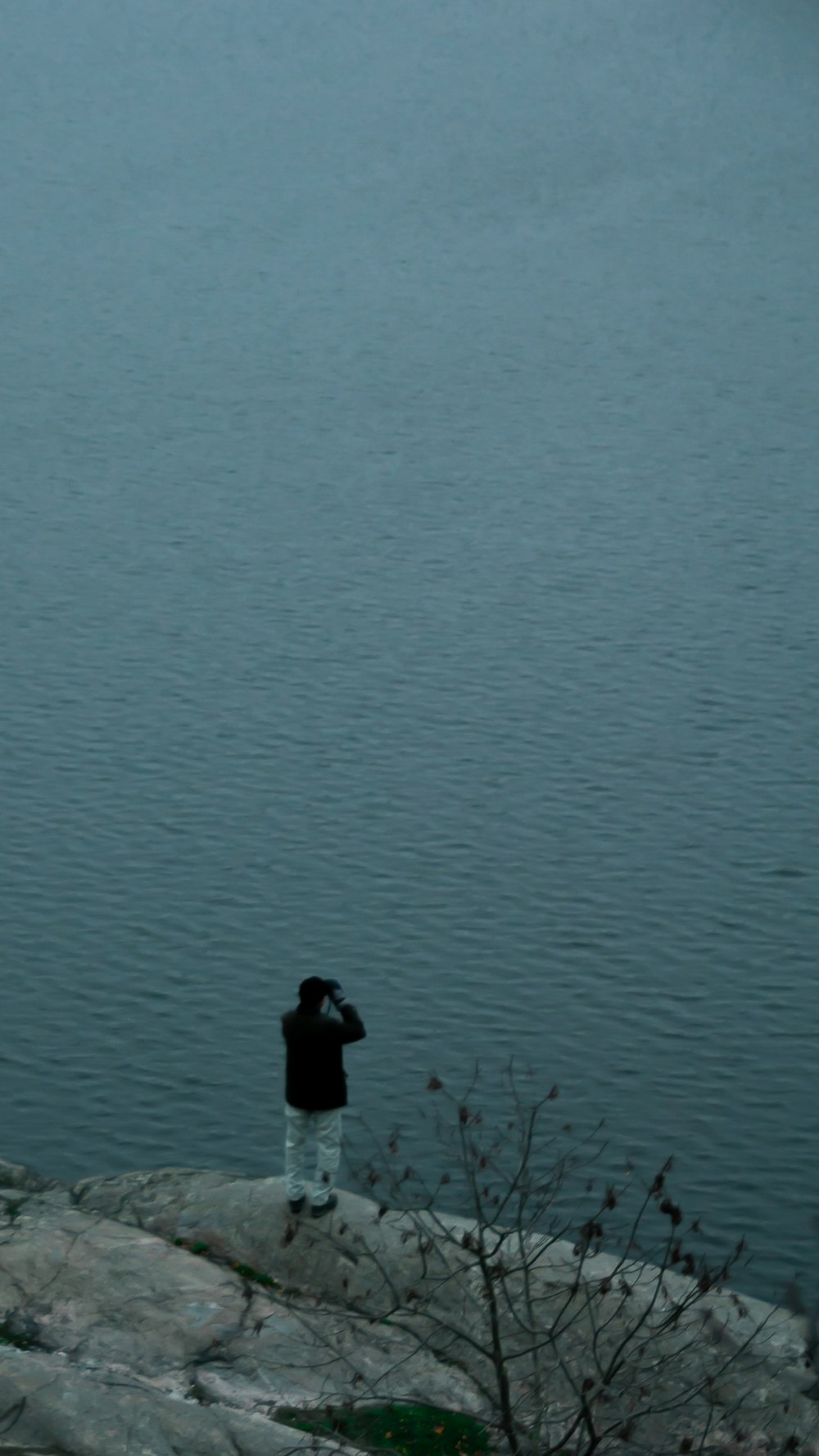 person standing on body of water during daytime