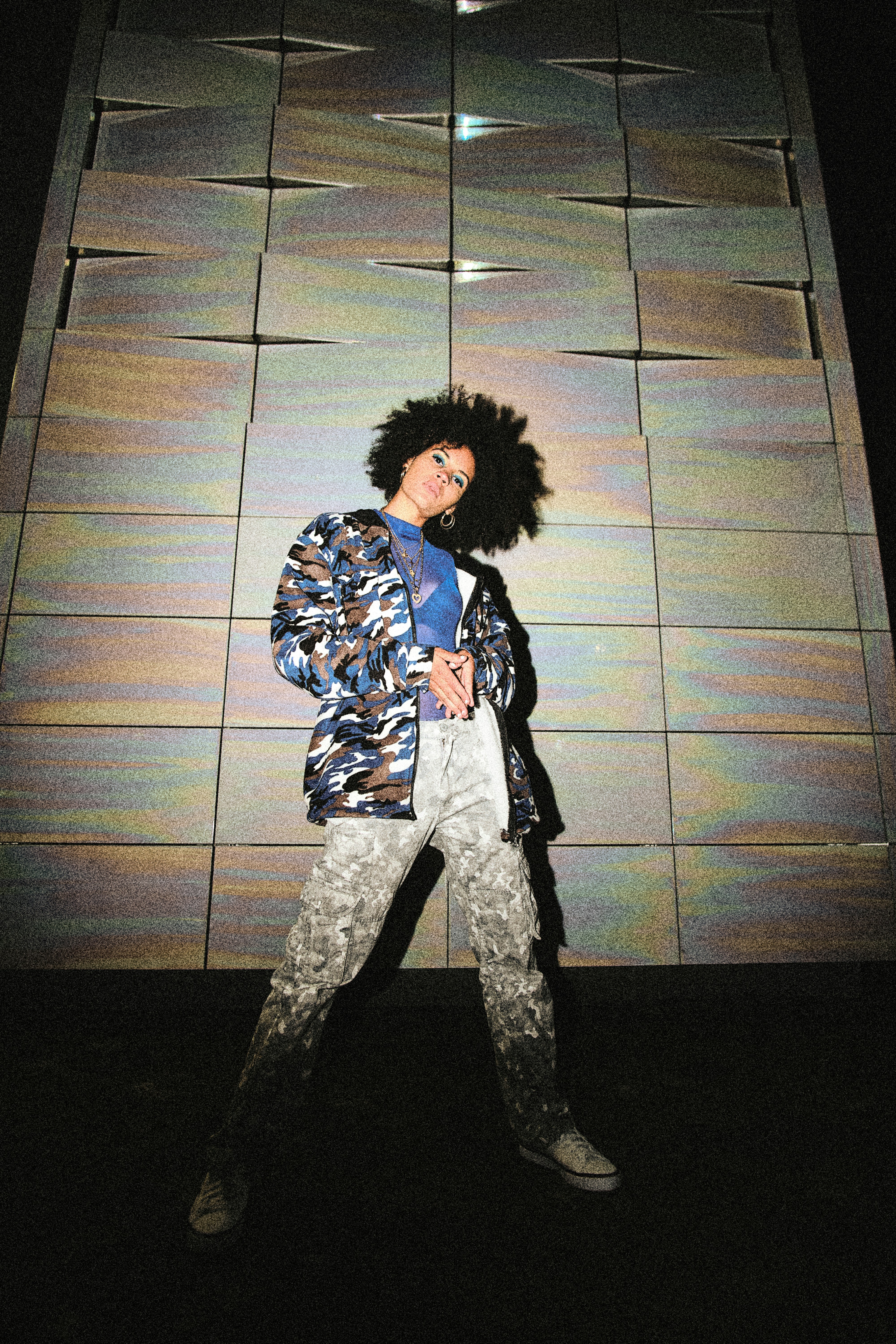 man in black and white checkered button up shirt standing