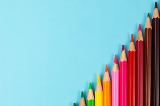 pink yellow green and blue color pencils
