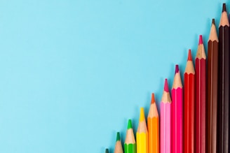 pink yellow green and blue color pencils