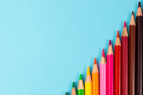 pink yellow green and blue color pencils