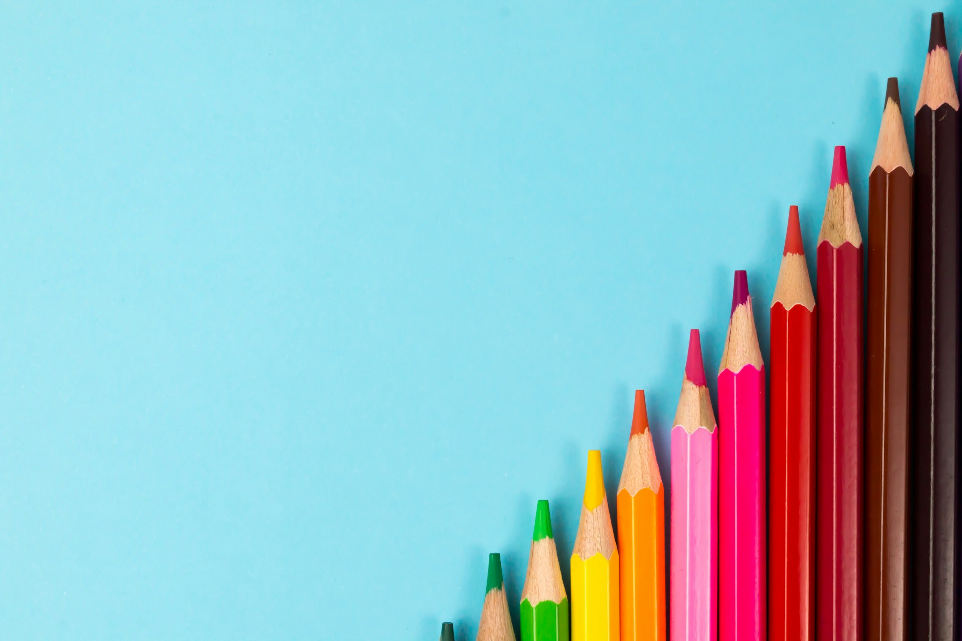 pink yellow green and blue color pencils