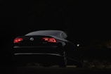 black porsche 911 parked on road during nighttime