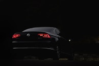 black porsche 911 parked on road during nighttime
